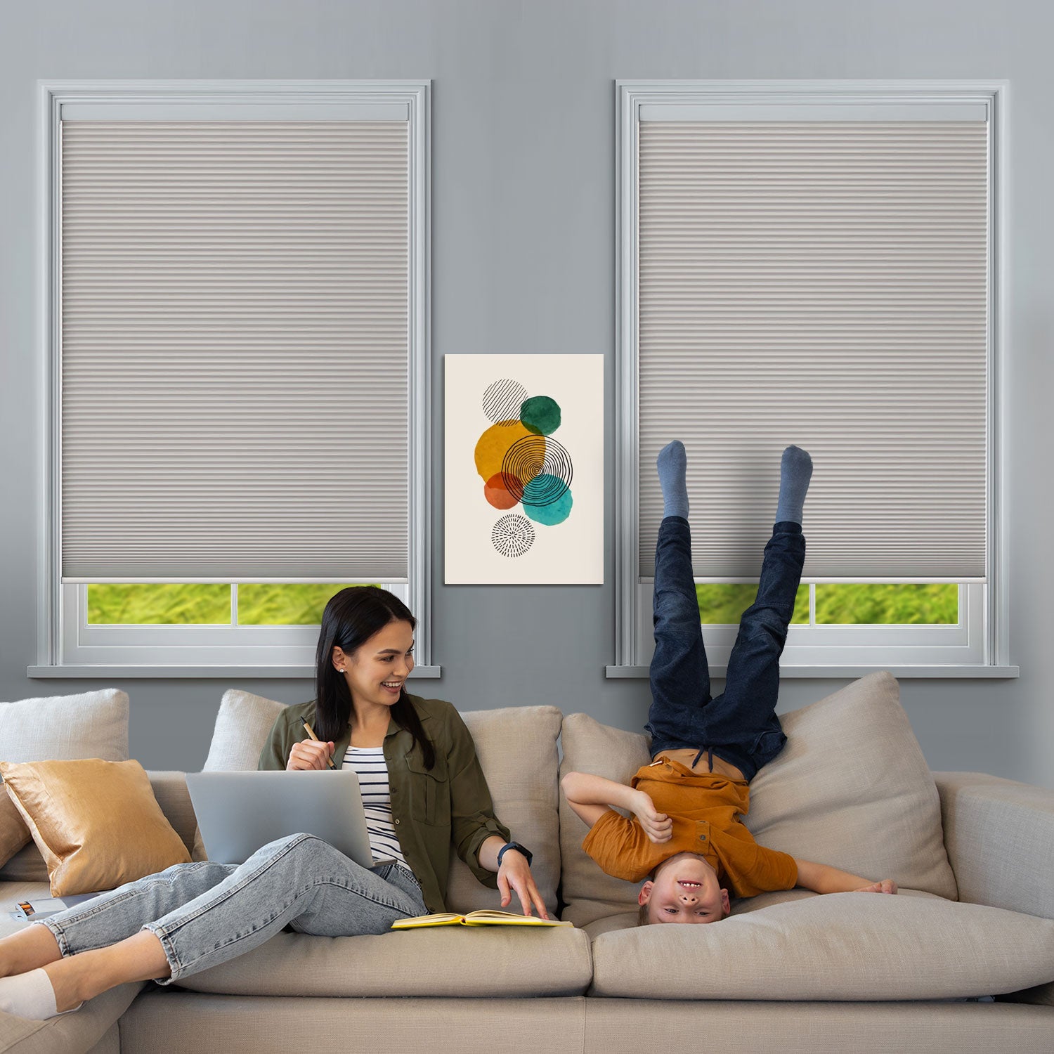 BlindsMagic 100% blackout cellular shades in a family living room, child-safe cordless design.