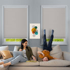 BlindsMagic 100% blackout cellular shades in a family living room, child-safe cordless design.