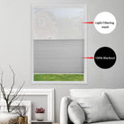 Comparison of light filtering mesh and blackout fabric on BlindsMagic day and night cellular shades.